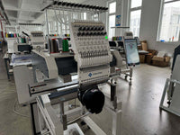 Kreatek III BL-1501 industrial embroidery machine with 15 needles, high-speed cap embroidery, digital screen, and Dahao control system in a textile workshop.