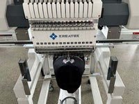 Kreatek BL-1501 industrial embroidery machine stitching a black cap with multiple needles and high-speed precision.