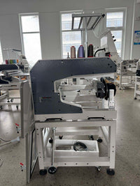 Kreatek BL-1501 high-speed industrial cap embroidery machine with 12/15 needles and 400x600mm embroidery area in a modern workshop.