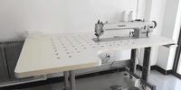 Industrial sewing machine Model GC0303-560-D4 with long 56cm arm, computerized direct drive system, top and bottom feeding, alternating transport, autotrimmer, and automatic foot lift on a sturdy white worktable.