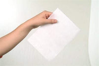 Madeira 9436 Tear Away stabilizer cotton soft white sheet held by hand for embroidery support
