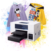 Sunika SK-30D DTG printer with vibrant multi-colored printed sweatshirts featuring cartoon characters and splash background