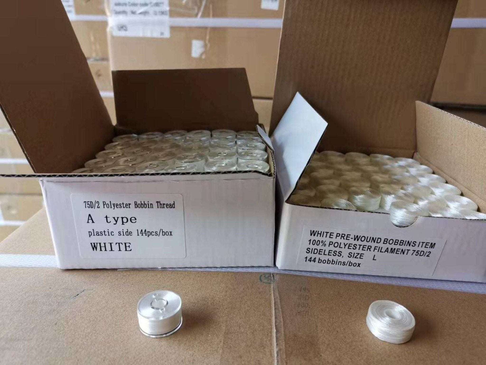 Box of 144 white pre-wound polyester plastic bobbins, ready to use for sewing projects