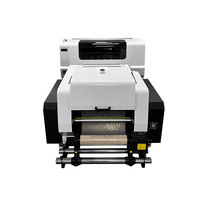 Yuxunda all-in-one DTF printer for high-speed textile printing with automatic white ink circulation and LED touchscreen control panel.