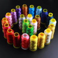 Colorful polyester embroidery thread spools arranged in a circle, showcasing a vibrant selection from a 100-color thread pack.